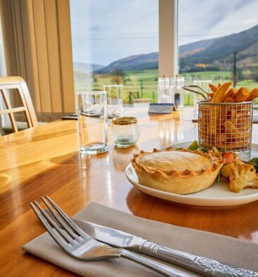 Meal at Glen Clova Hotel restaurant with views of the glens