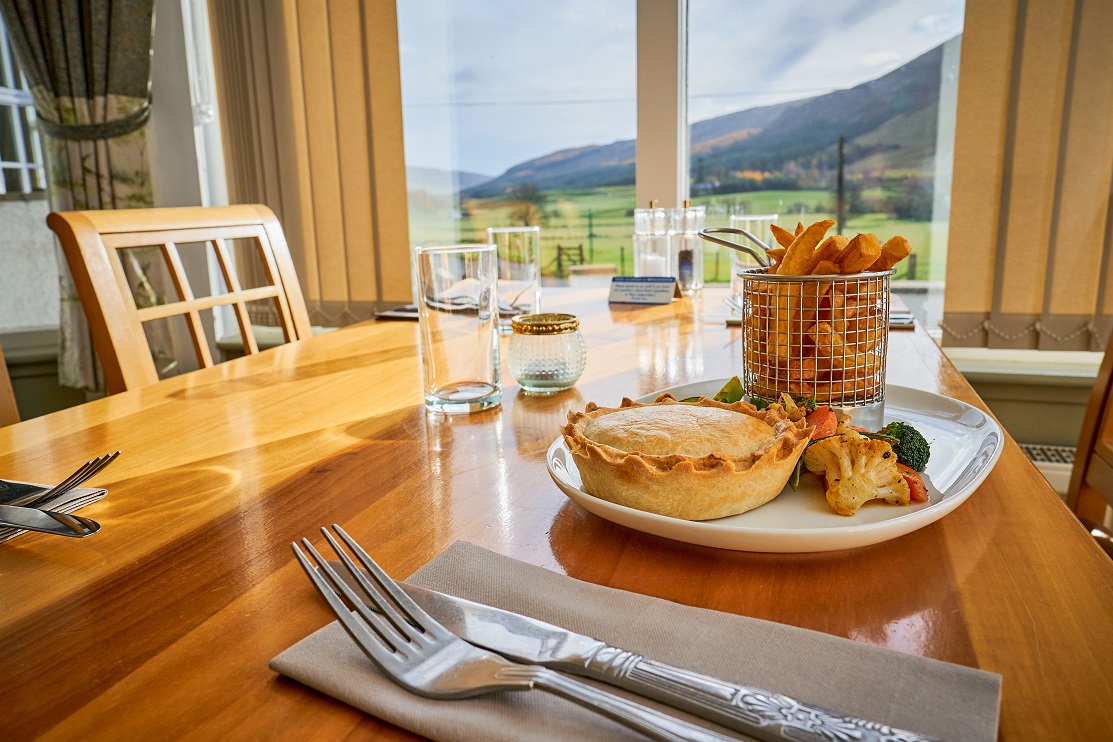 Meal at Glen Clova Hotel restaurant with views of the glens